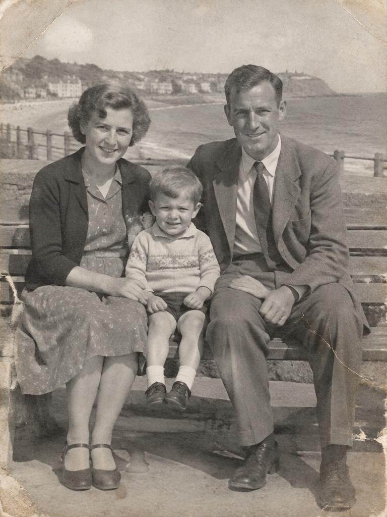 The illustrative photograph before restoration, faded and scratched